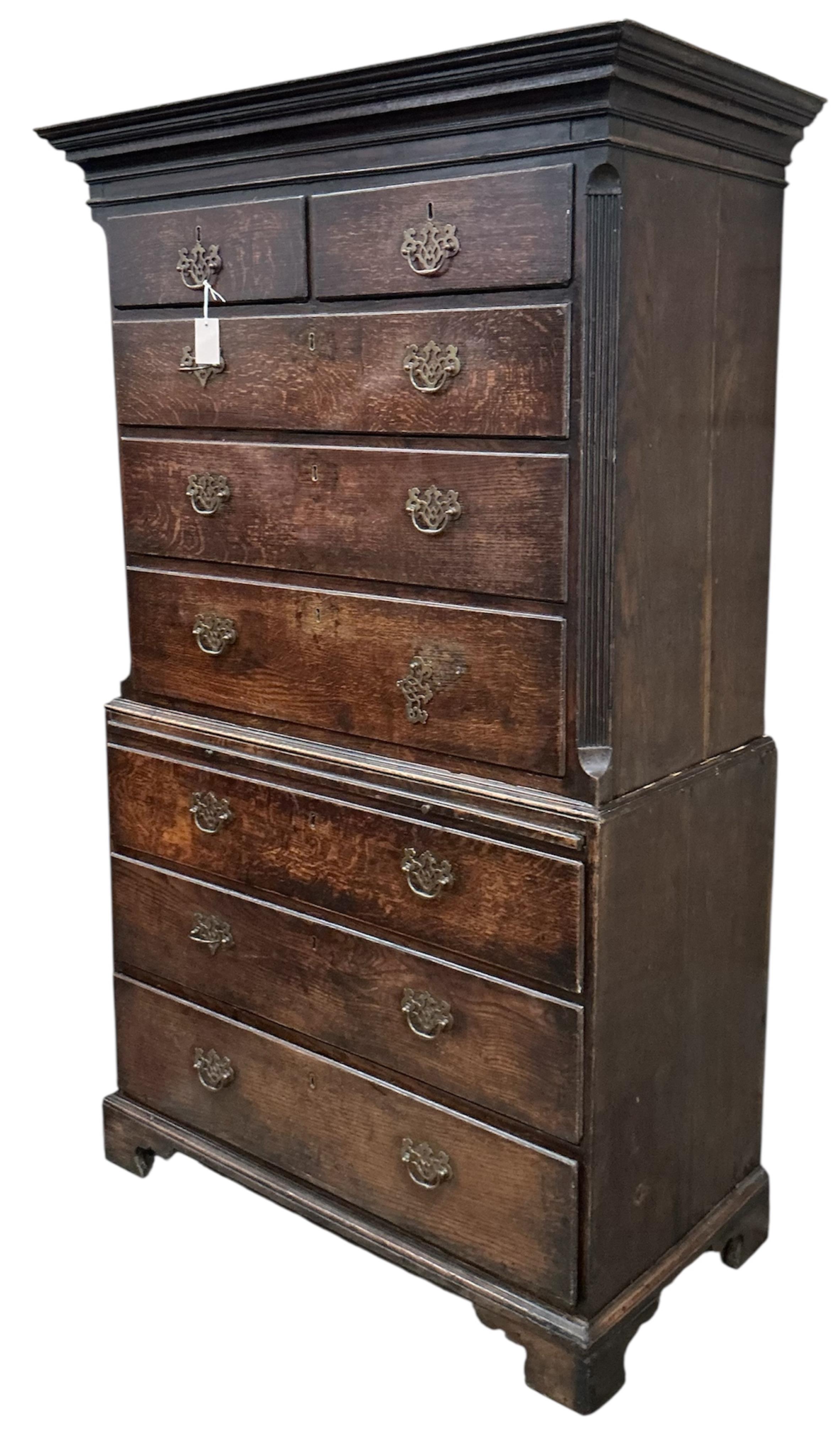 A George III oak chest on chest with slide, width 106cm, depth 52cm, height 186cm